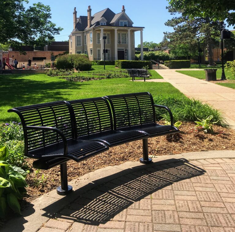 Cook Park benches and gardens facing the Ansel B. Cook Home in downtown Libertyville Illinois